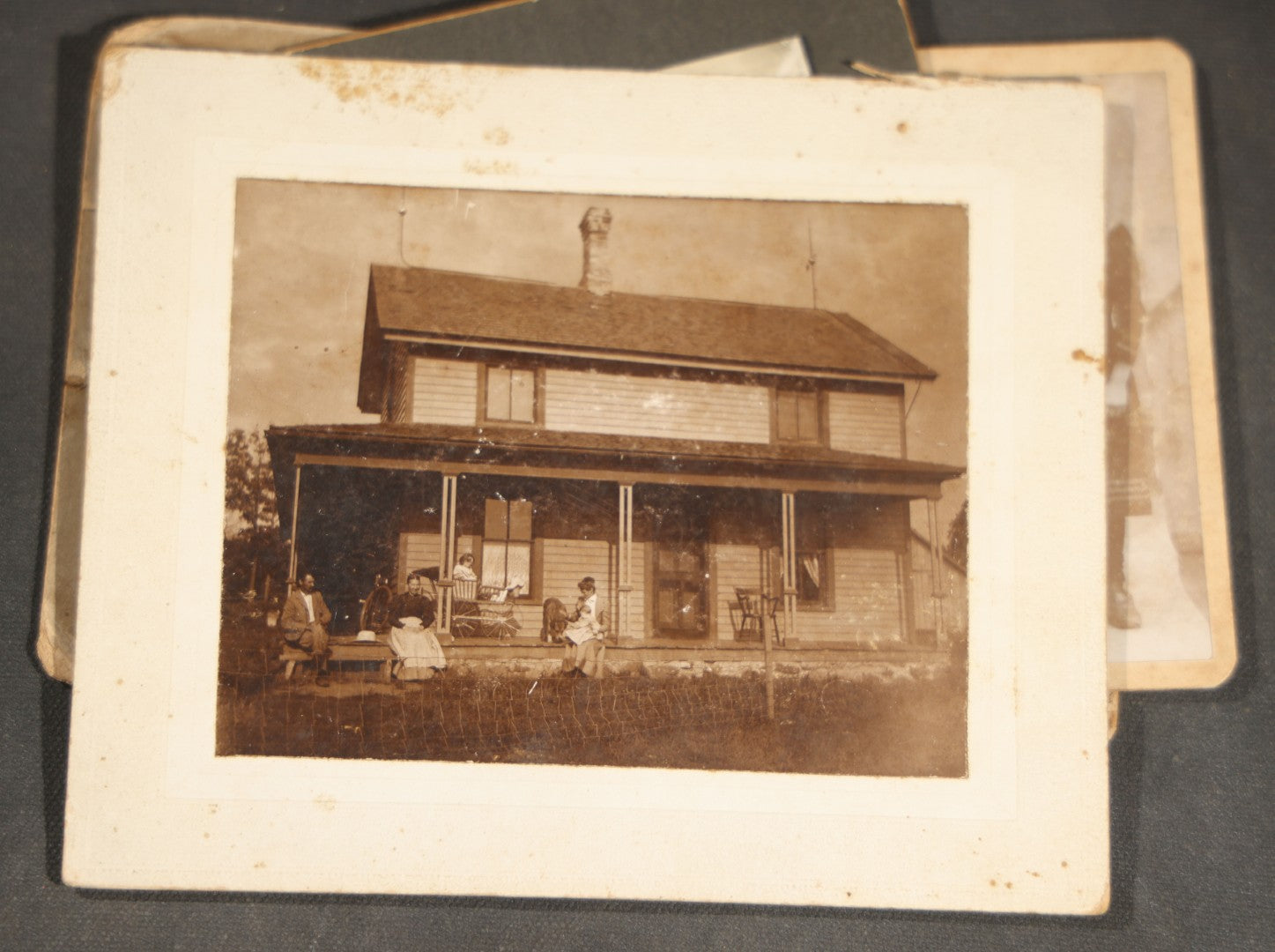 Grouping of 10 Antique and Vintage Photographs including a Boy with Wagon, a Railroad Car, C.D.V.s, cabinet cards, and Family Groups