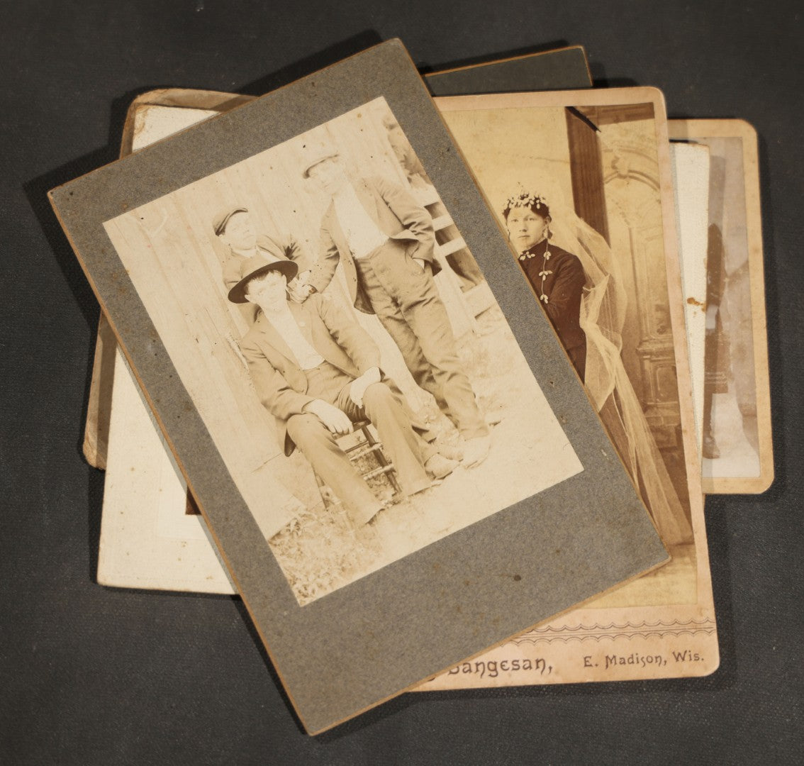 Grouping of 10 Antique and Vintage Photographs including a Boy with Wagon, a Railroad Car, C.D.V.s, cabinet cards, and Family Groups