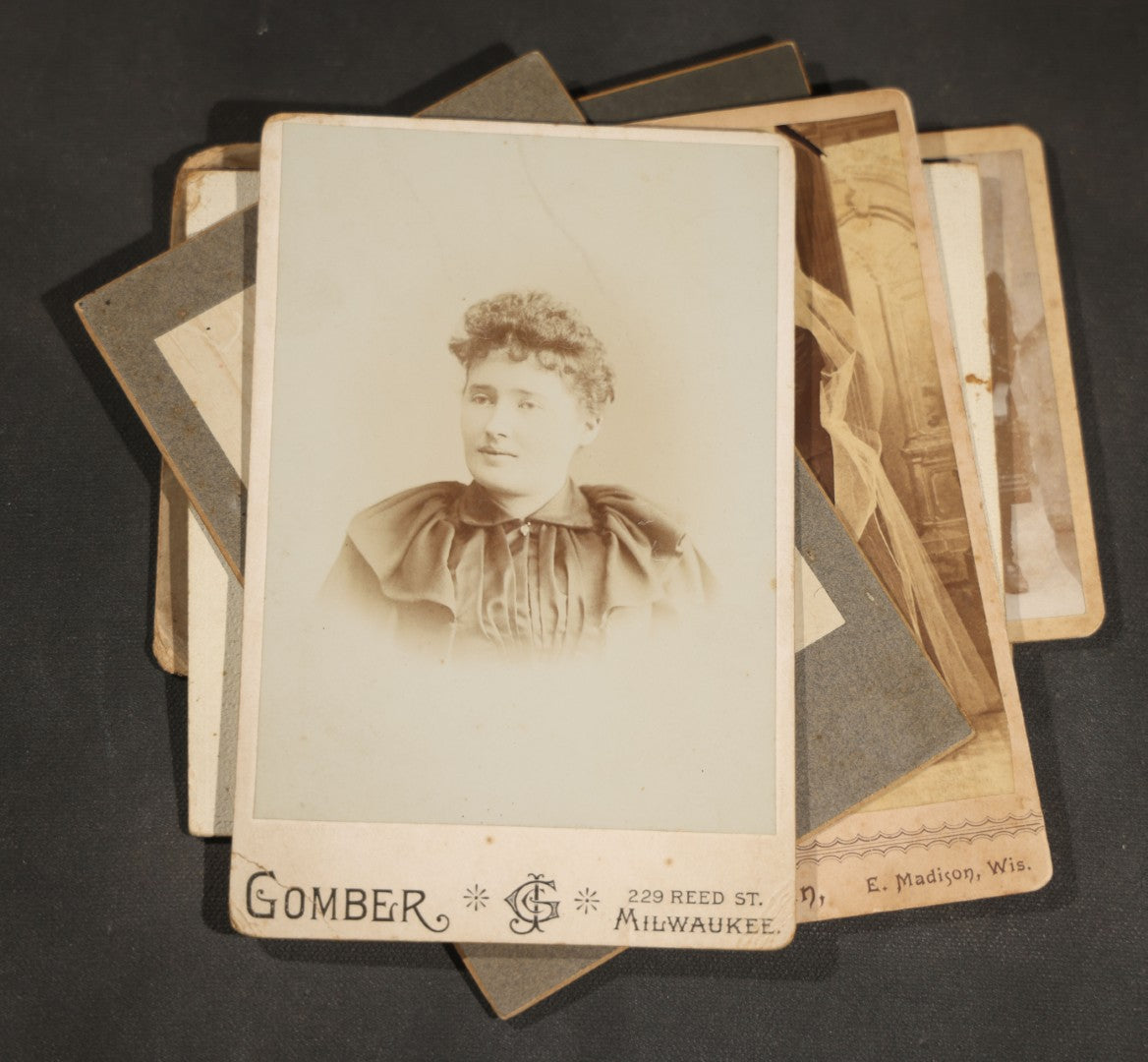 Grouping of 10 Antique and Vintage Photographs including a Boy with Wagon, a Railroad Car, C.D.V.s, cabinet cards, and Family Groups