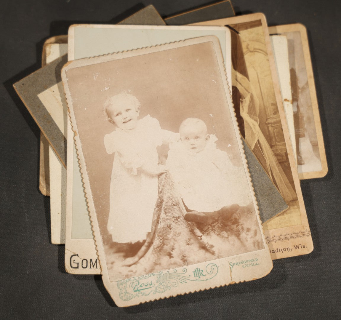 Grouping of 10 Antique and Vintage Photographs including a Boy with Wagon, a Railroad Car, C.D.V.s, cabinet cards, and Family Groups