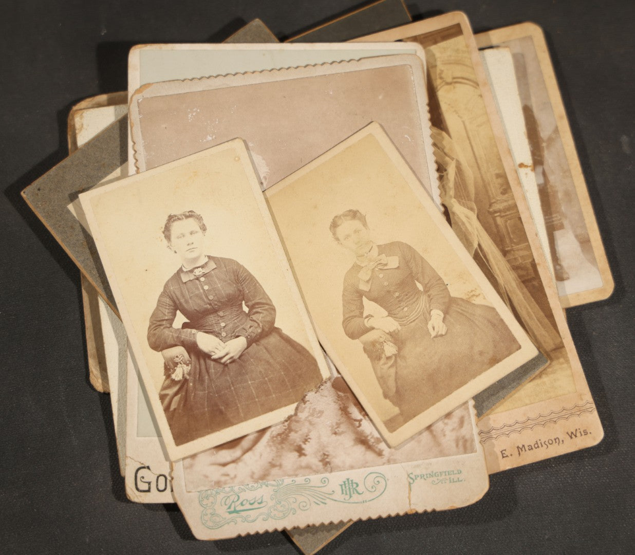 Grouping of 10 Antique and Vintage Photographs including a Boy with Wagon, a Railroad Car, C.D.V.s, cabinet cards, and Family Groups