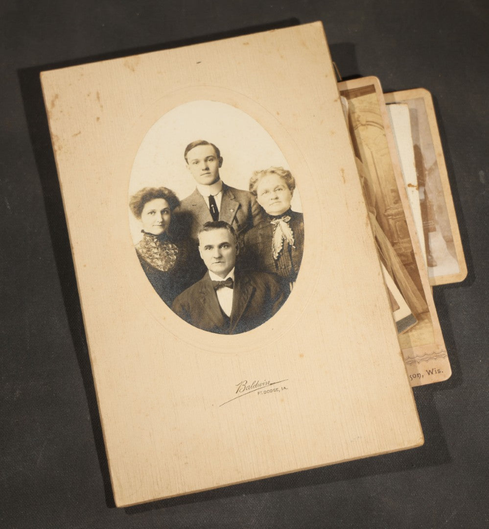 Grouping of 10 Antique and Vintage Photographs including a Boy with Wagon, a Railroad Car, C.D.V.s, cabinet cards, and Family Groups