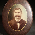 Lot 041 - Antique Victorian Celluloid Photo Button with Oval Portrait of Man with Handlebar Mustache in Wood Frame, 7-3/4" H