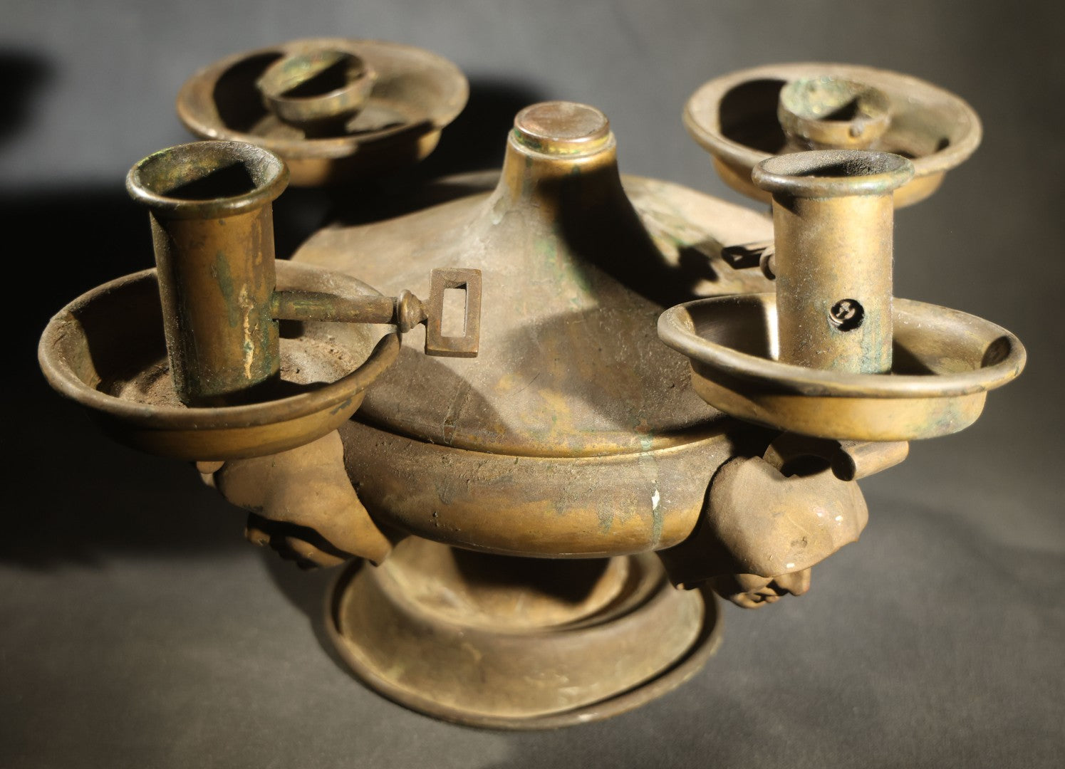 Antique Brass Four-Burner Oil Lamp with Monk Faces Sticking Out Tongues, Missing Two Burners