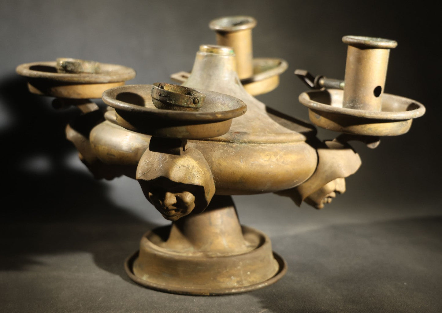 Antique Brass Four-Burner Oil Lamp with Monk Faces Sticking Out Tongues, Missing Two Burners