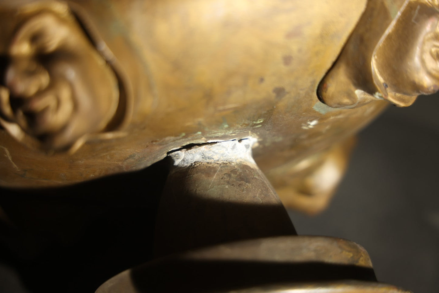 Antique Brass Four-Burner Oil Lamp with Monk Faces Sticking Out Tongues, Missing Two Burners