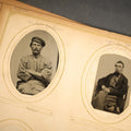 Lot 017 - Antique Portrait Photo Album Containing 21 Tintypes, 25 C.D.V.S, and 13 Cabinet Cards Including Hidden Mother Tintype, Occupational Tintype, and C.D.V. of Tall Smiling Man Holding Open Book, Many Pencil Identifications, Album in Poor Condition