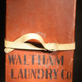 Lot 023 - Vintage Waltham Laundry Co. Industrial Laundry Case with Canvas Strap, Stenciled "Waltham Laundry Co Waltham, Mass.", Waltham, Massachusetts, 19-1/2" L x 10" W x 5-1/4" H