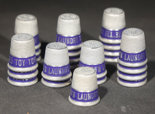 Grouping of 23 Vintage Advertising Thimbles for Toy Town Laundry, Winchendon, Massachusetts, Tel. 325