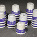 Lot 024 - Grouping of 23 Vintage Advertising Thimbles for Toy Town Laundry, Winchendon, Massachusetts, Tel. 325, 3/4" H each