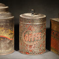 Lot 032 - Trio of Antique Toleware Tins Including Tea Canister with Yellow Band, Coffee Canister with Red Stenciling, and Walter Baker & Co. Breakfast Cocoa Container, Dorchester, Massachusetts
