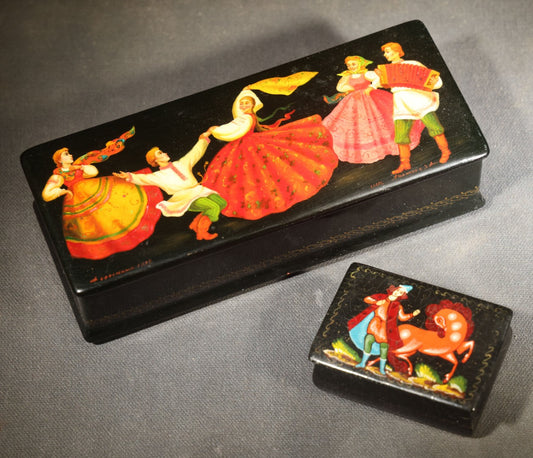 Pair of Vintage Russian Black Lacquer Boxes with Hand-Painted Folk Dancing and Equestrian Scenes, Gold Borders, Larger Box Marked Made in U.S.S.R.