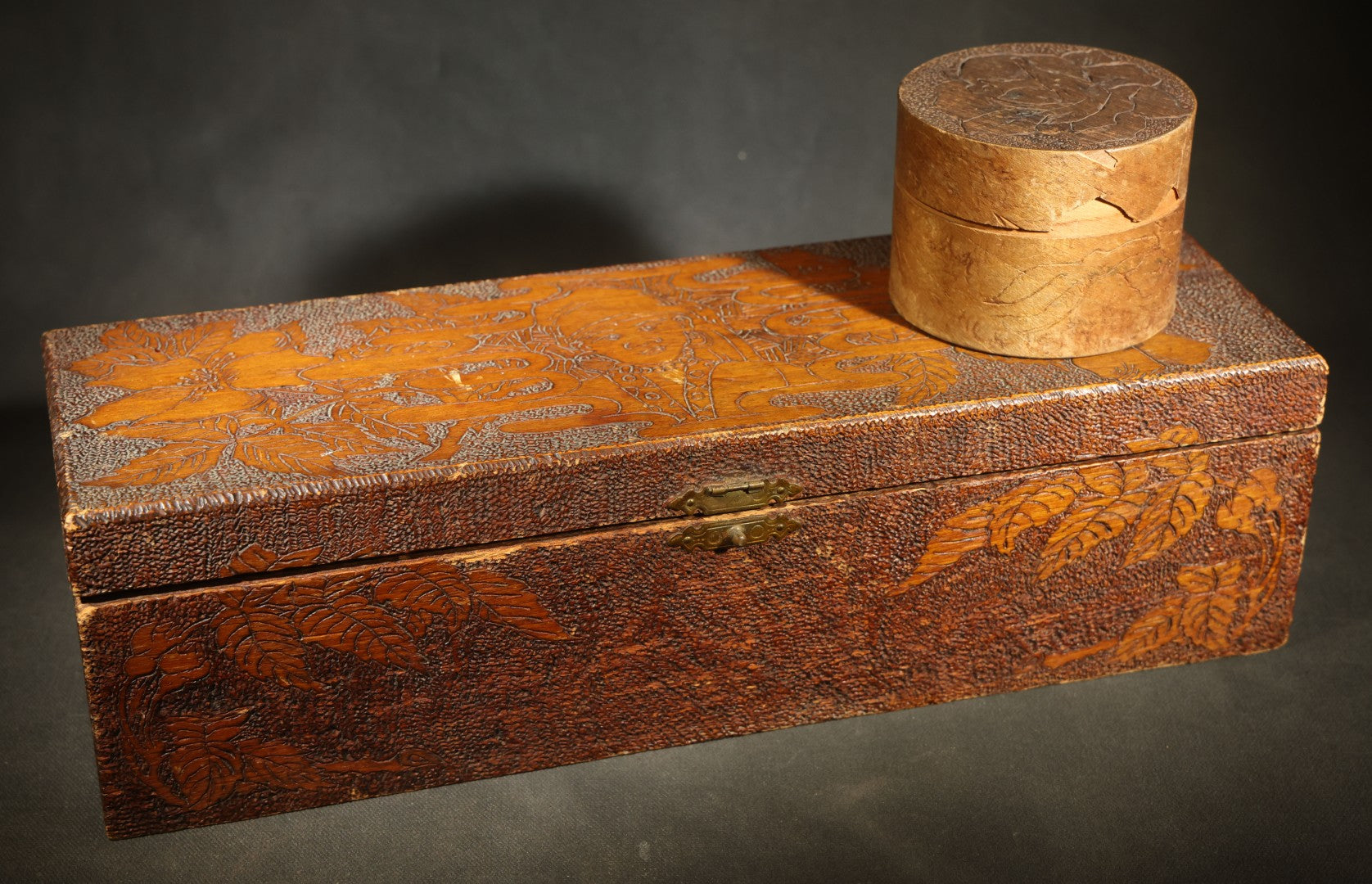 Pair of Antique Pyrography Boxes Including Signed "C.O.D. 1904" Rectangular Example with Dutch Figures and Round "Mount Washington Box" with Rose Design