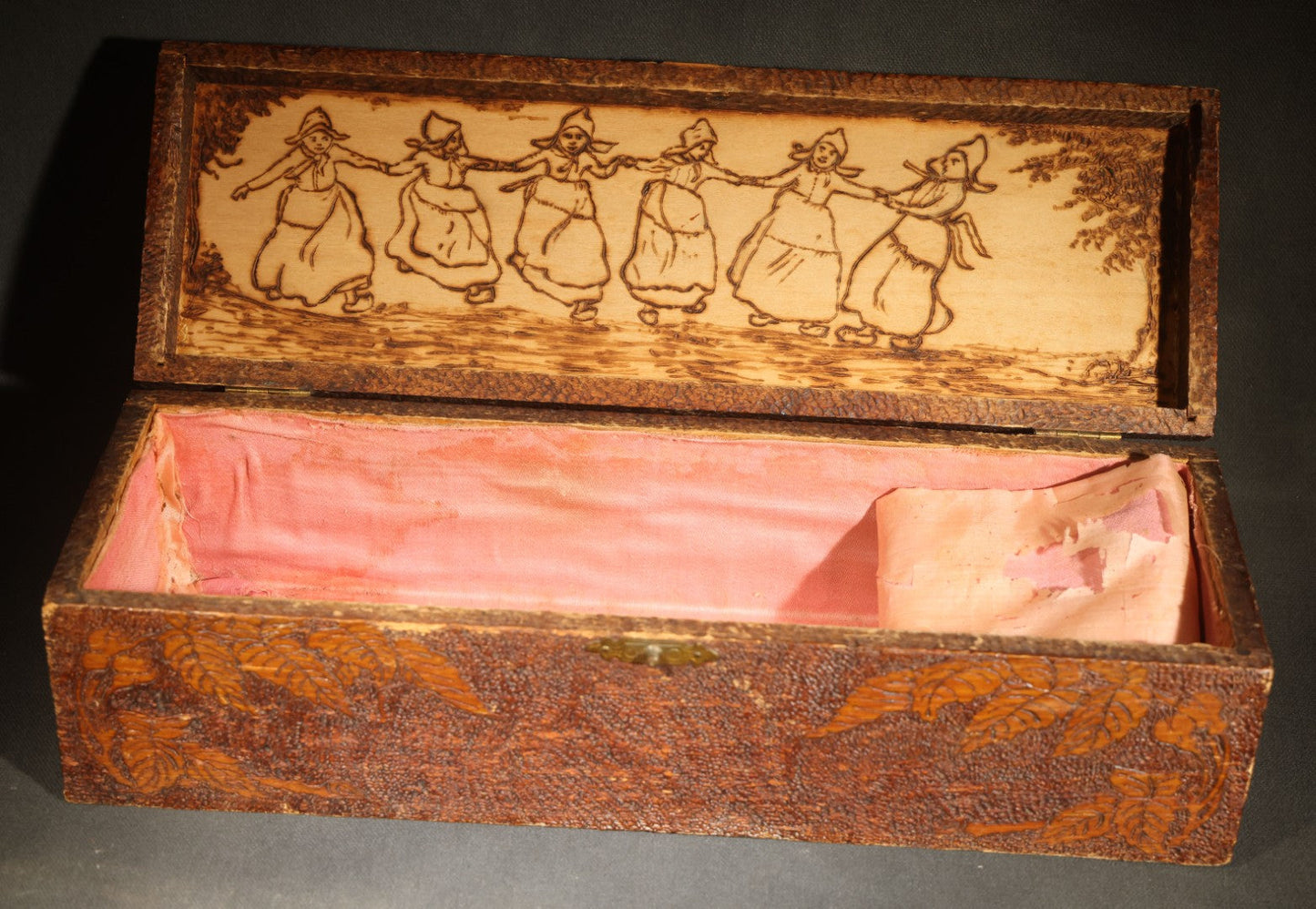 Pair of Antique Pyrography Boxes Including Signed "C.O.D. 1904" Rectangular Example with Dutch Figures and Round "Mount Washington Box" with Rose Design