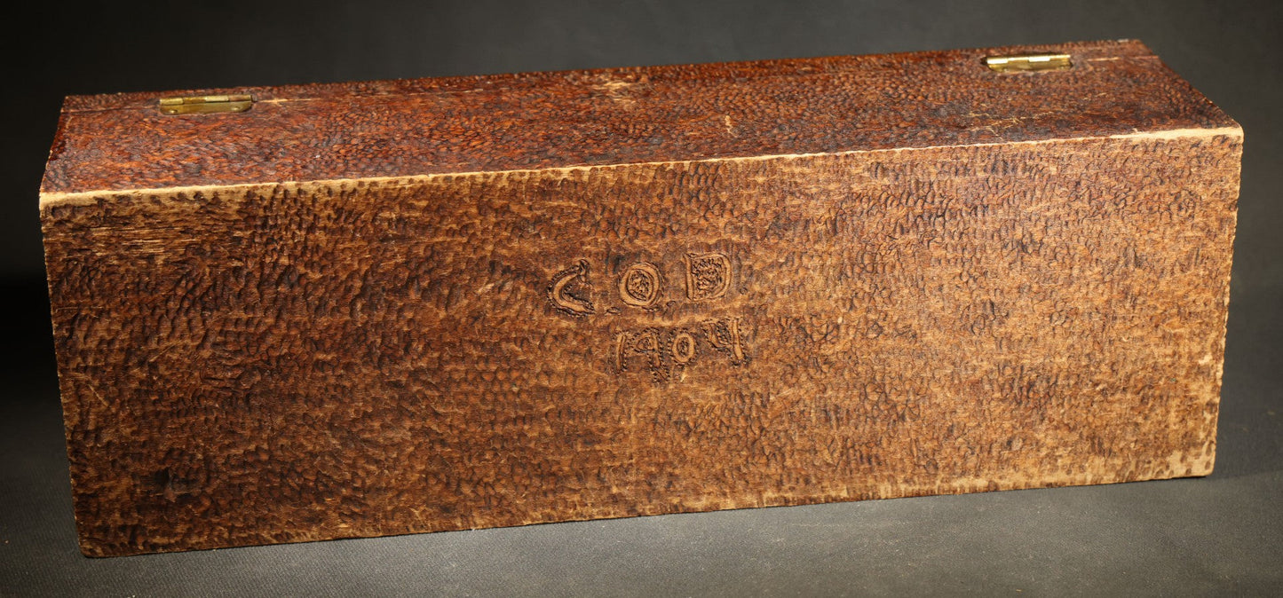 Pair of Antique Pyrography Boxes Including Signed "C.O.D. 1904" Rectangular Example with Dutch Figures and Round "Mount Washington Box" with Rose Design