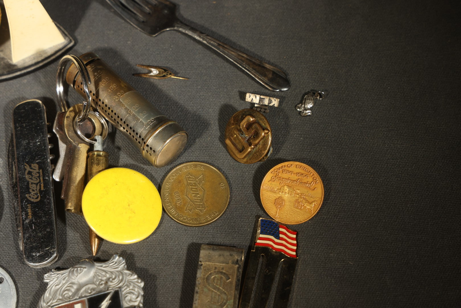 Vintage Junk Drawer Lot Including Bisque Doll, Howdy Doody Head Political Campaign Pins, Advertising Pocket Mirror, Tokens, Keys, and Silverplate Flatware