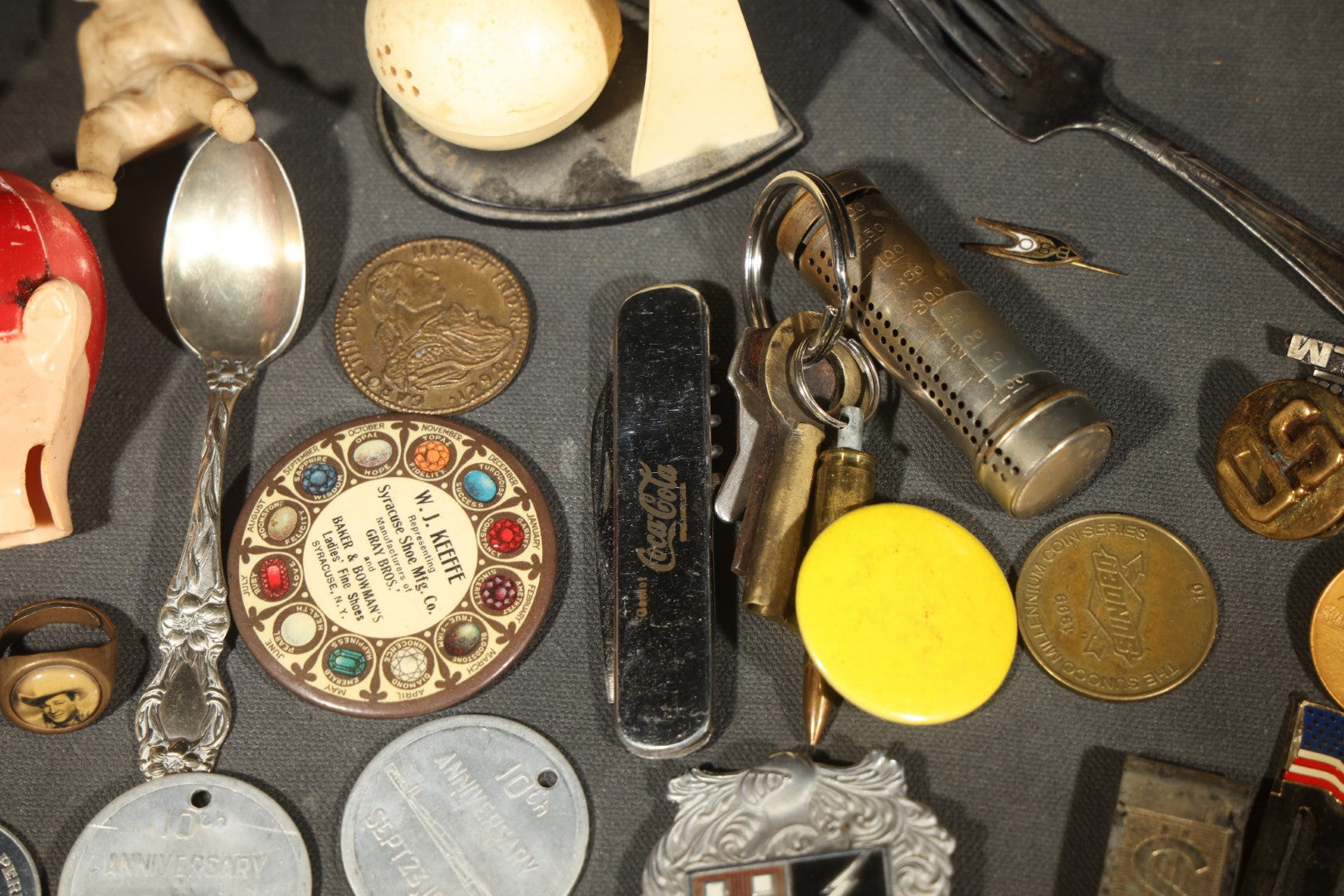 Vintage Junk Drawer Lot Including Bisque Doll, Howdy Doody Head Political Campaign Pins, Advertising Pocket Mirror, Tokens, Keys, and Silverplate Flatware