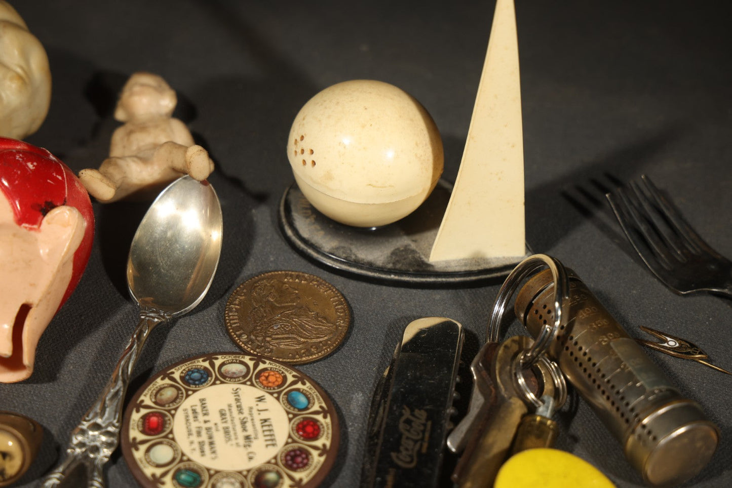 Vintage Junk Drawer Lot Including Bisque Doll, Howdy Doody Head Political Campaign Pins, Advertising Pocket Mirror, Tokens, Keys, and Silverplate Flatware