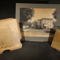 Lot 071 - Trio of Vintage Board-Mounted Photographs Including Two-Story House with American Flags, Multi-Story Industrial Building with Gathered Crowd and High Wheel Bicycle, and Small Railroad Depot