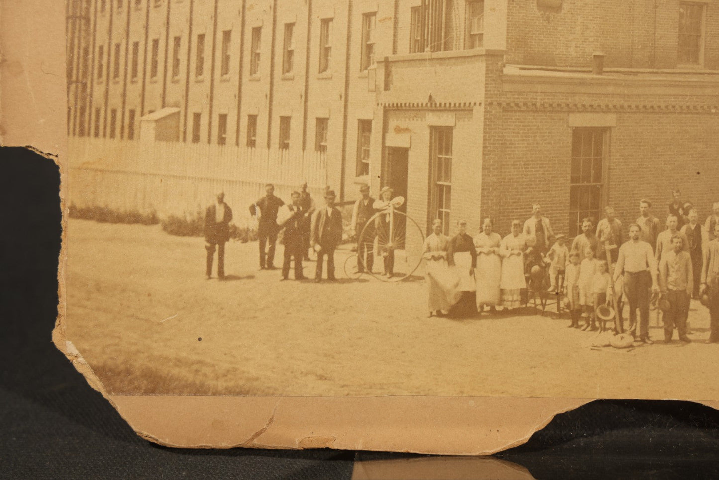 Trio of Vintage Board-Mounted Photographs Including Two-Story House with American Flags, Multi-Story Industrial Building with Gathered Crowd and High Wheel Bicycle, and Small Railroad Depot