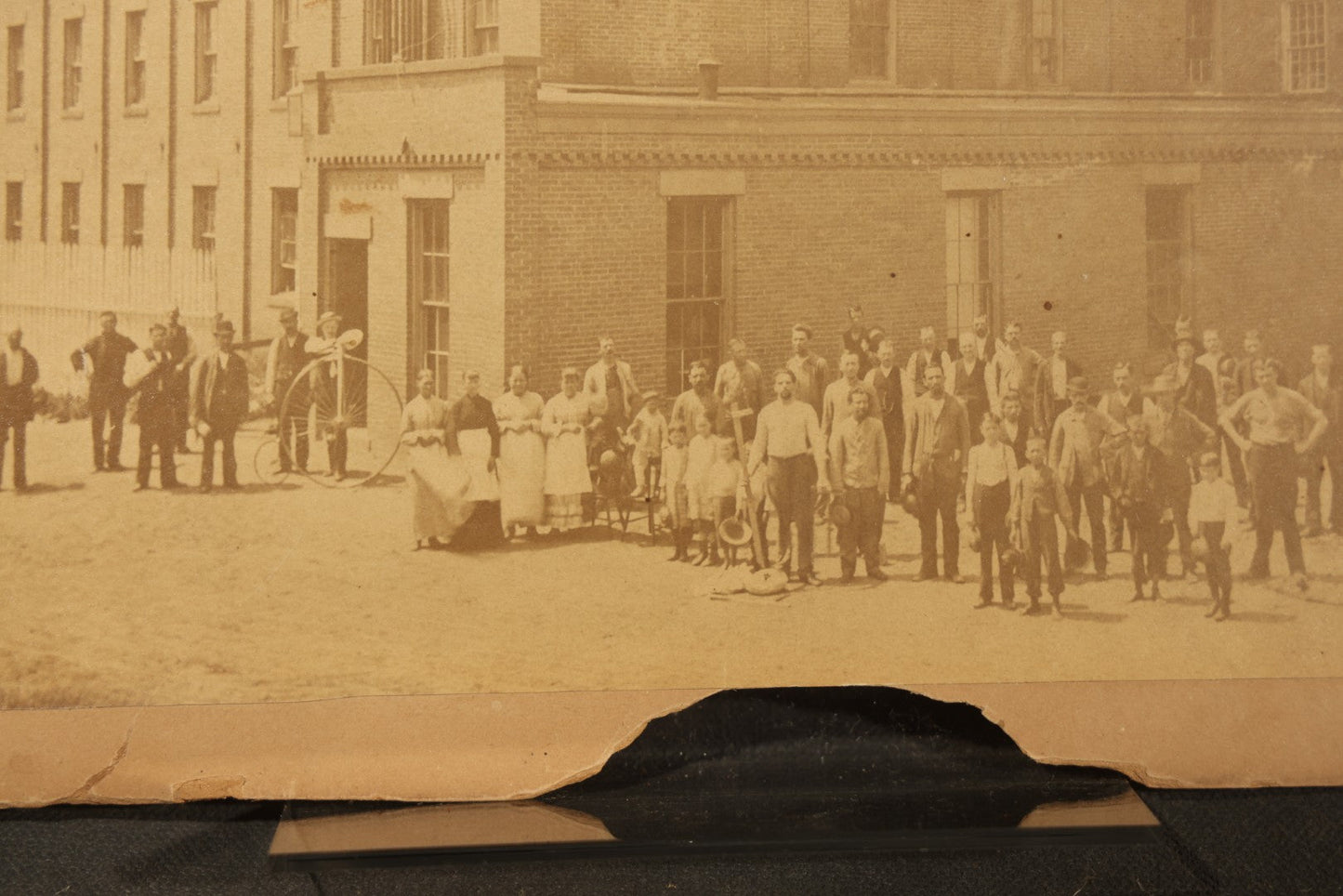 Trio of Vintage Board-Mounted Photographs Including Two-Story House with American Flags, Multi-Story Industrial Building with Gathered Crowd and High Wheel Bicycle, and Small Railroad Depot