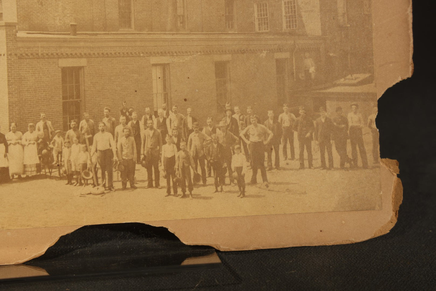 Trio of Vintage Board-Mounted Photographs Including Two-Story House with American Flags, Multi-Story Industrial Building with Gathered Crowd and High Wheel Bicycle, and Small Railroad Depot