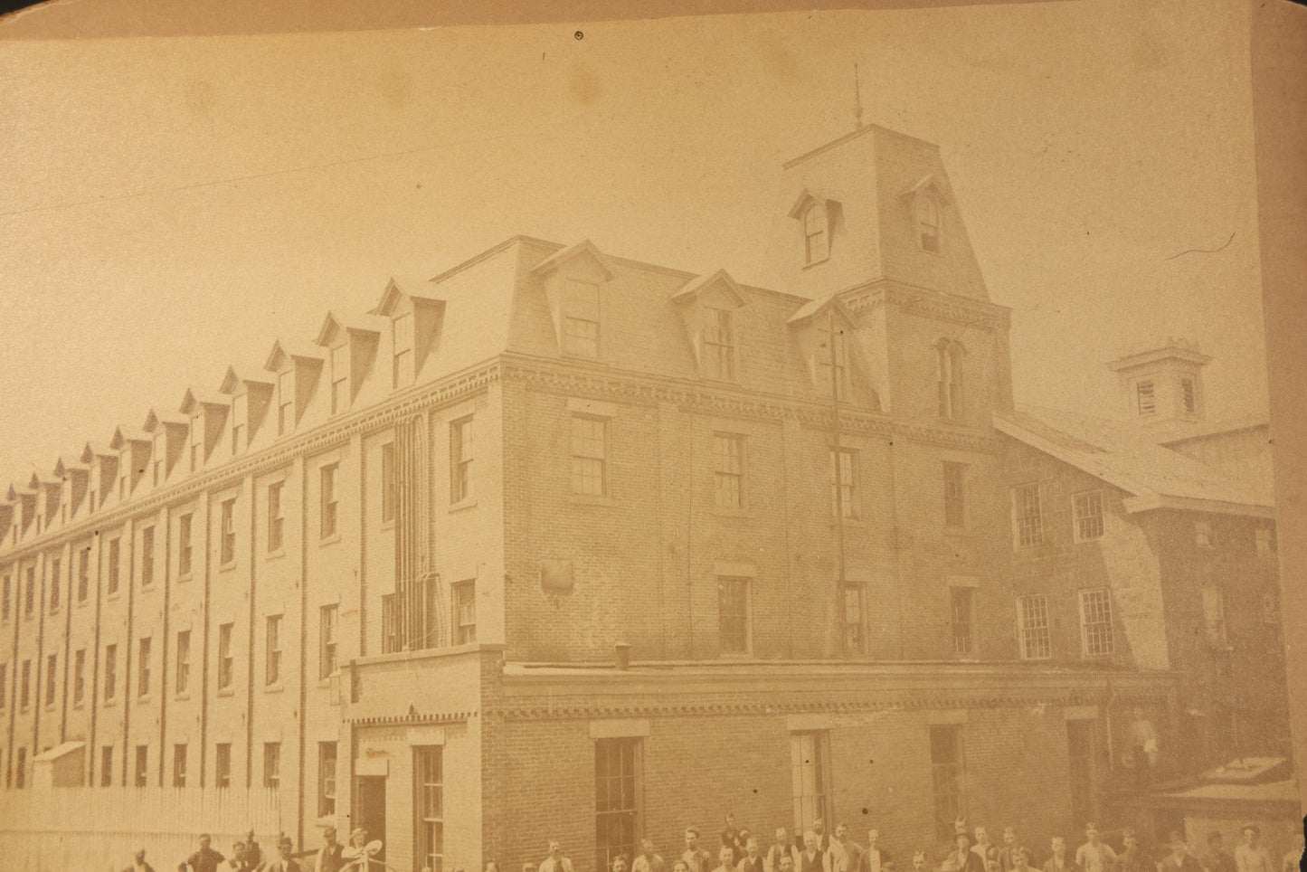 Trio of Vintage Board-Mounted Photographs Including Two-Story House with American Flags, Multi-Story Industrial Building with Gathered Crowd and High Wheel Bicycle, and Small Railroad Depot