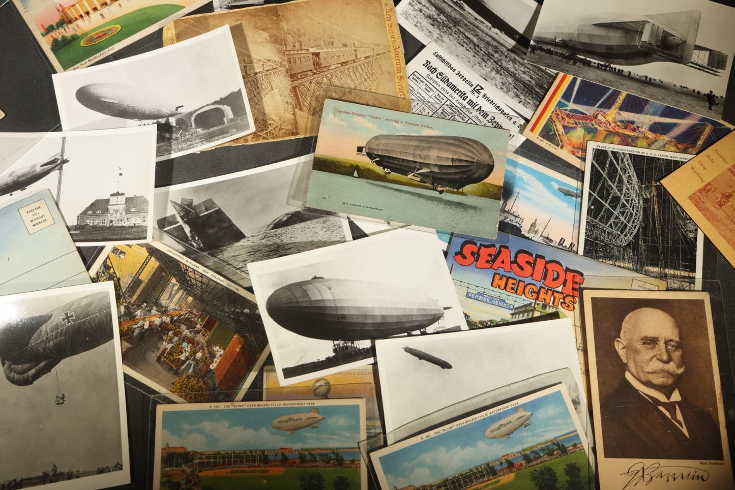 Grouping of 20+ Vintage Zeppelin and Dirigible Ephemera including Real Photo Postcards R.P.P.C., Seaside Heights Souvenir, and Portrait of Ferdinand Von Zeppelin