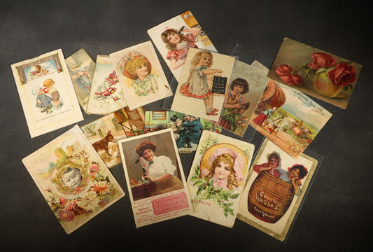 Grouping of 15 Antique Trade Cards and Postcards including Victorian Children, Greetings, Floral Designs, and Advertising Cards