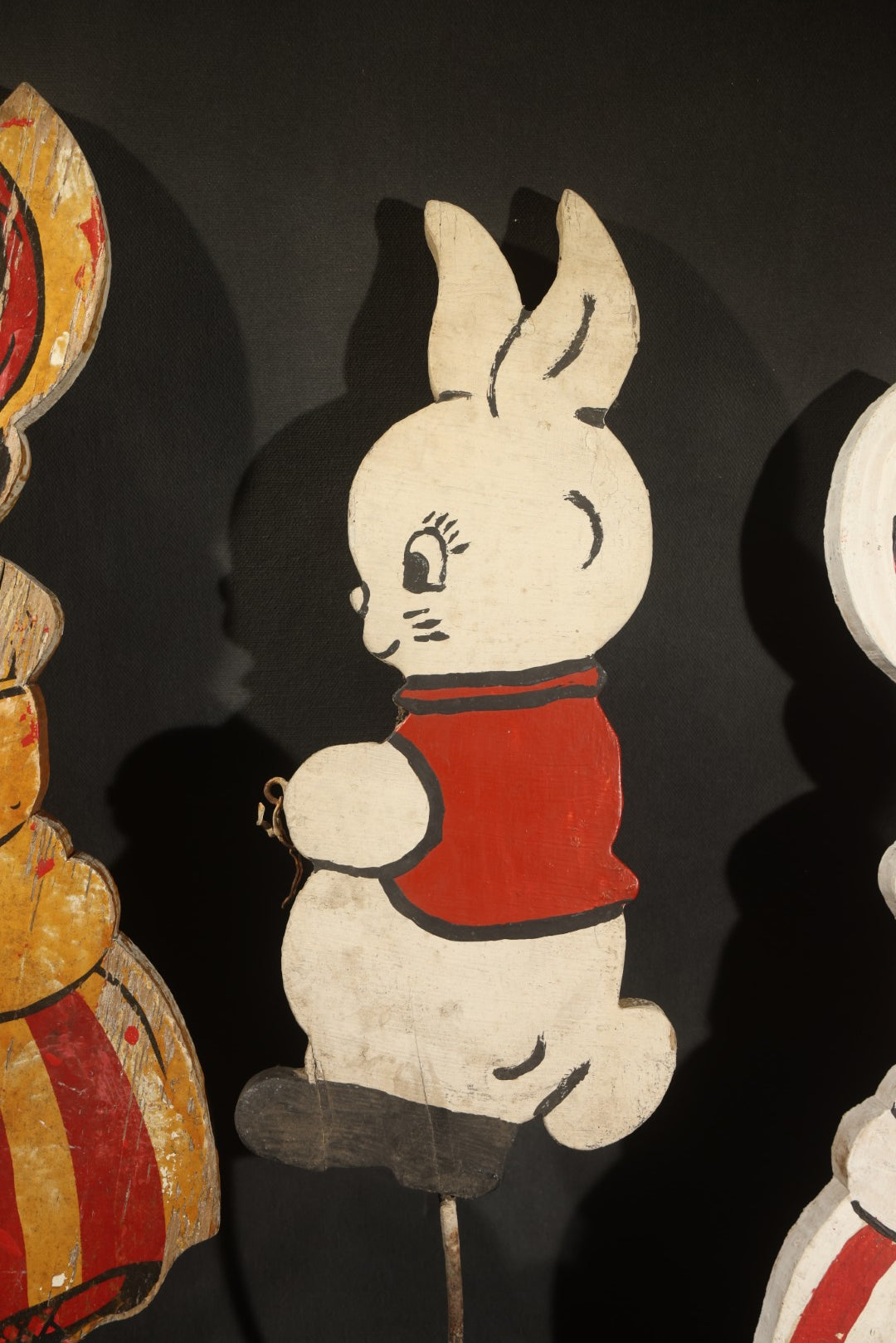 Trio of Vintage Folk Art Painted Wood Lawn Ornaments Including Two Girls in Bonnets with Red and White Striped Skirts and White Rabbit
