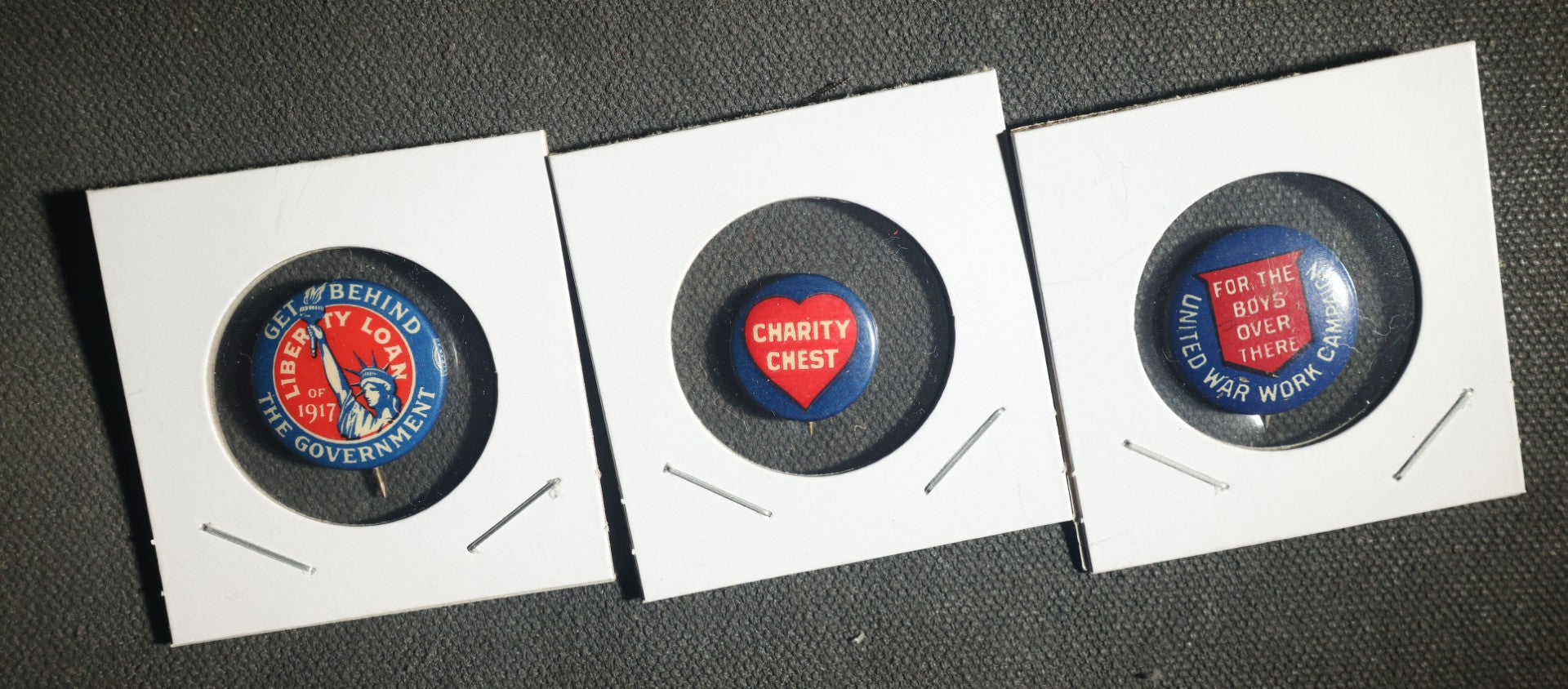 Trio of Buttons, Liberty Loan 1917, Charity Chest, and United War Campaign for the Boys Over There