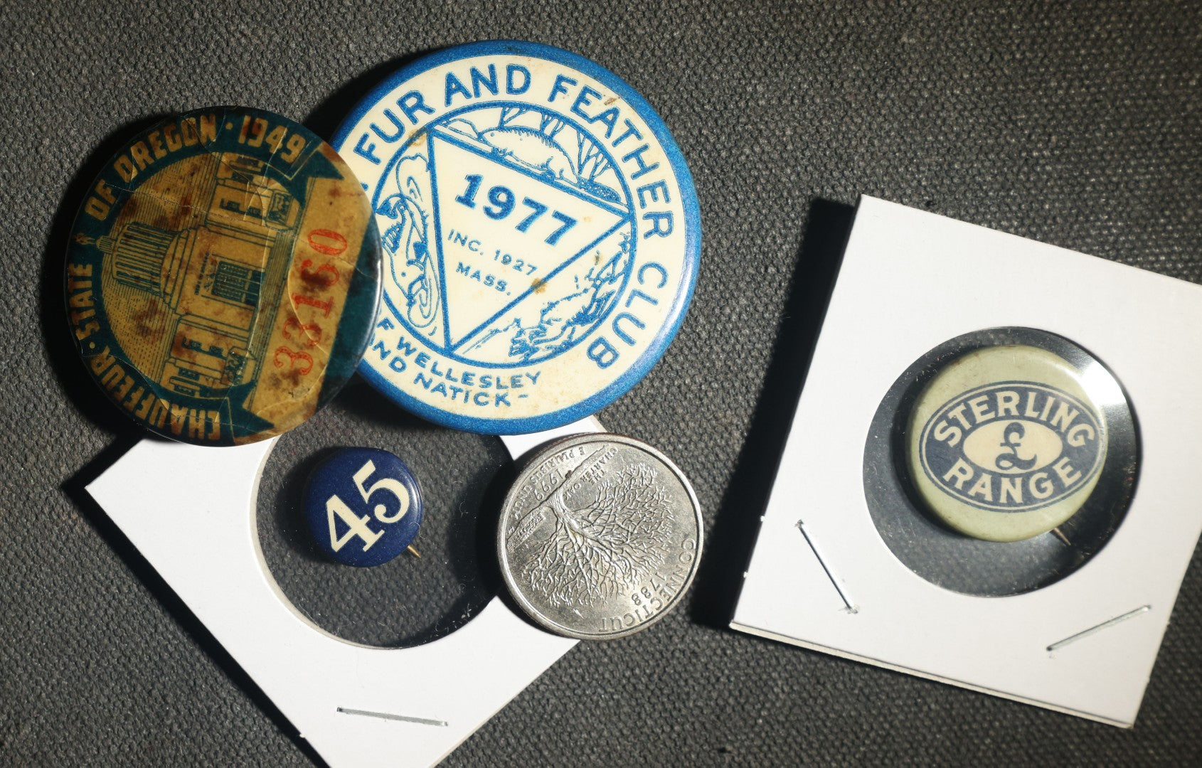 Four Buttons, Chauffer License State of Oregon 1949, Fin and Feathre Club of Wellesley and Natick Mass 1977, Sterling Range, and "45"