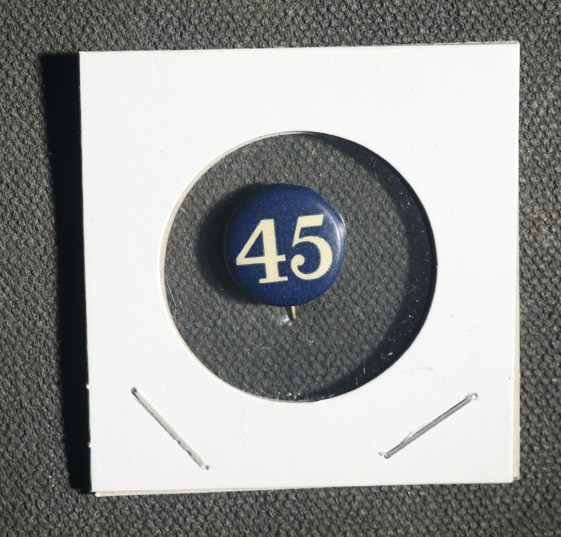 Four Buttons, Chauffer License State of Oregon 1949, Fin and Feathre Club of Wellesley and Natick Mass 1977, Sterling Range, and "45"
