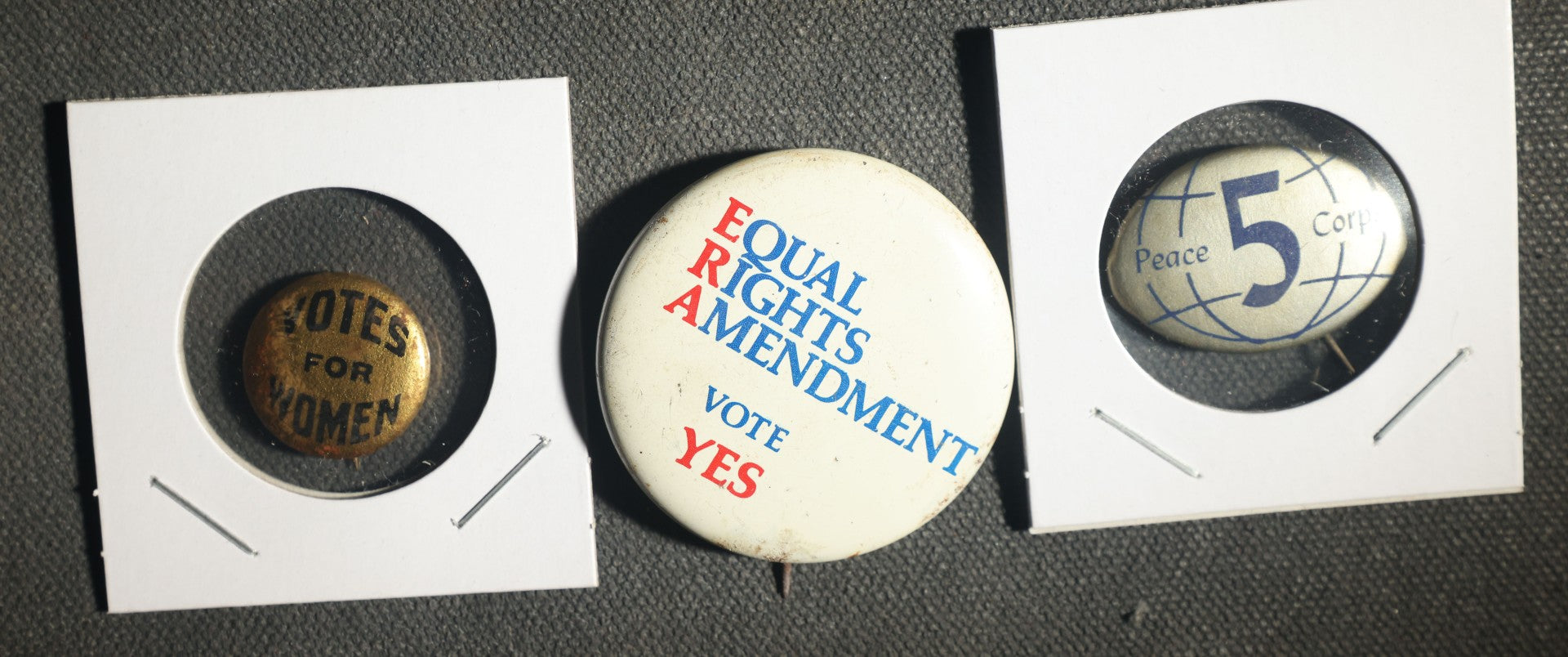 Trio of Political Buttons Including Votes for Women, Equal Rights Ammendment, and Peace Corps
