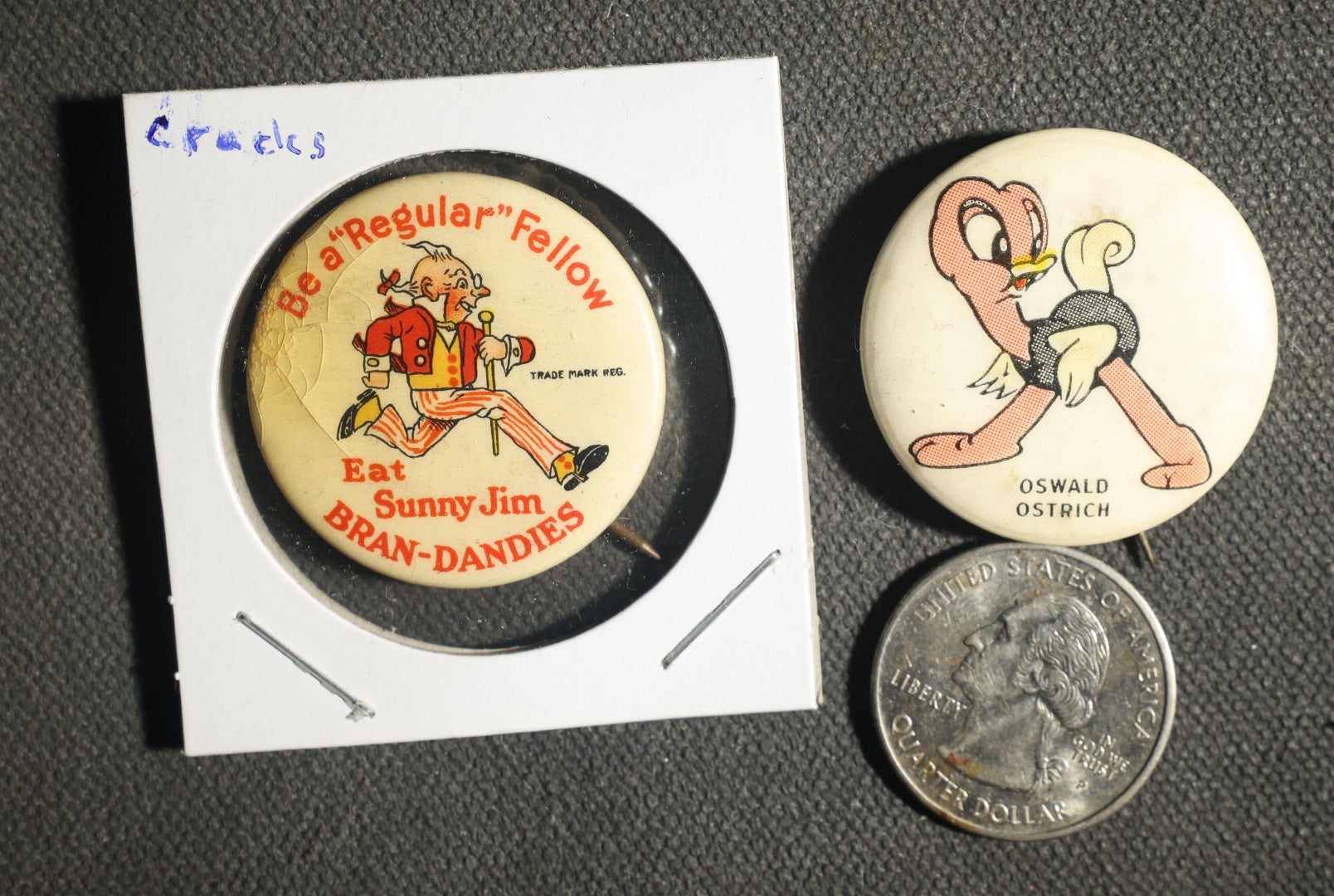 Pair of Cartoon Buttons Including Sunny Jim Bran-Dandies Advertisement and Oswald Ostrich