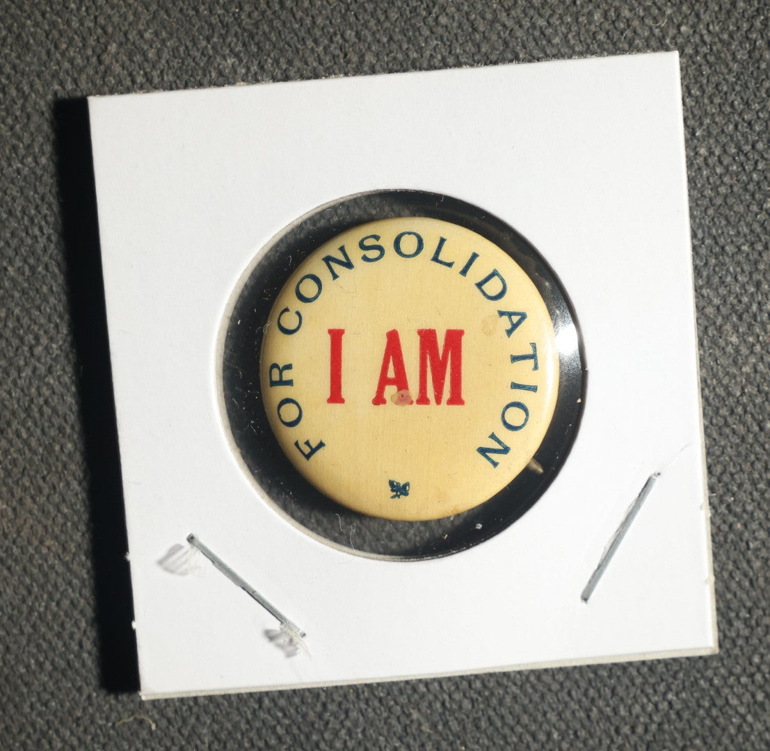 Pair of Political Action Buttons, I AM for Consolidation and Register for August 26th