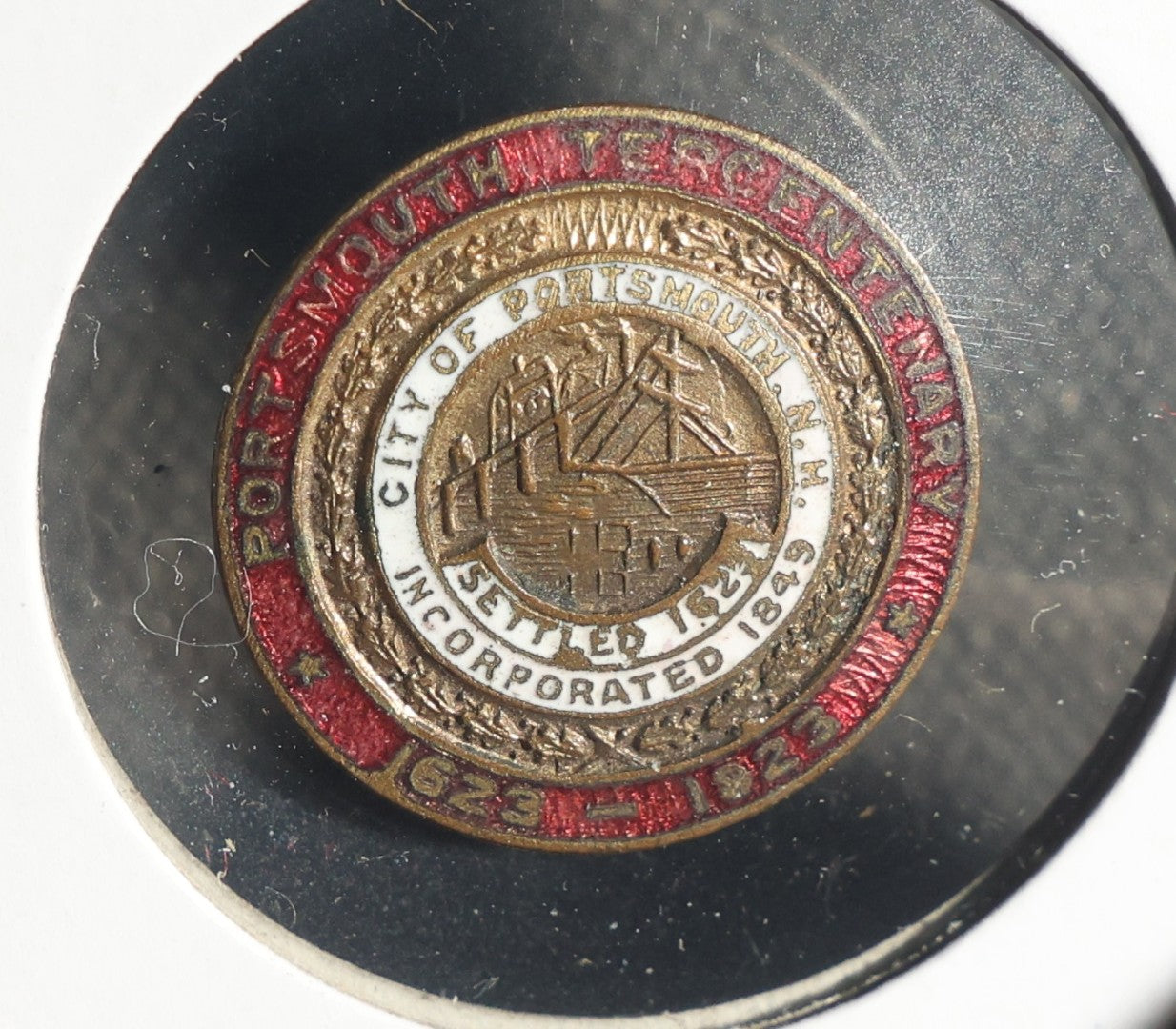 Three Items Including Woman's American Baptist Foreign Mission Society 50 Year Anniversary Button, Portsmouth New Hampshire Tercentenary 1623-1923 Studback, and Boston and Maine Railroad Safety First Stud Back