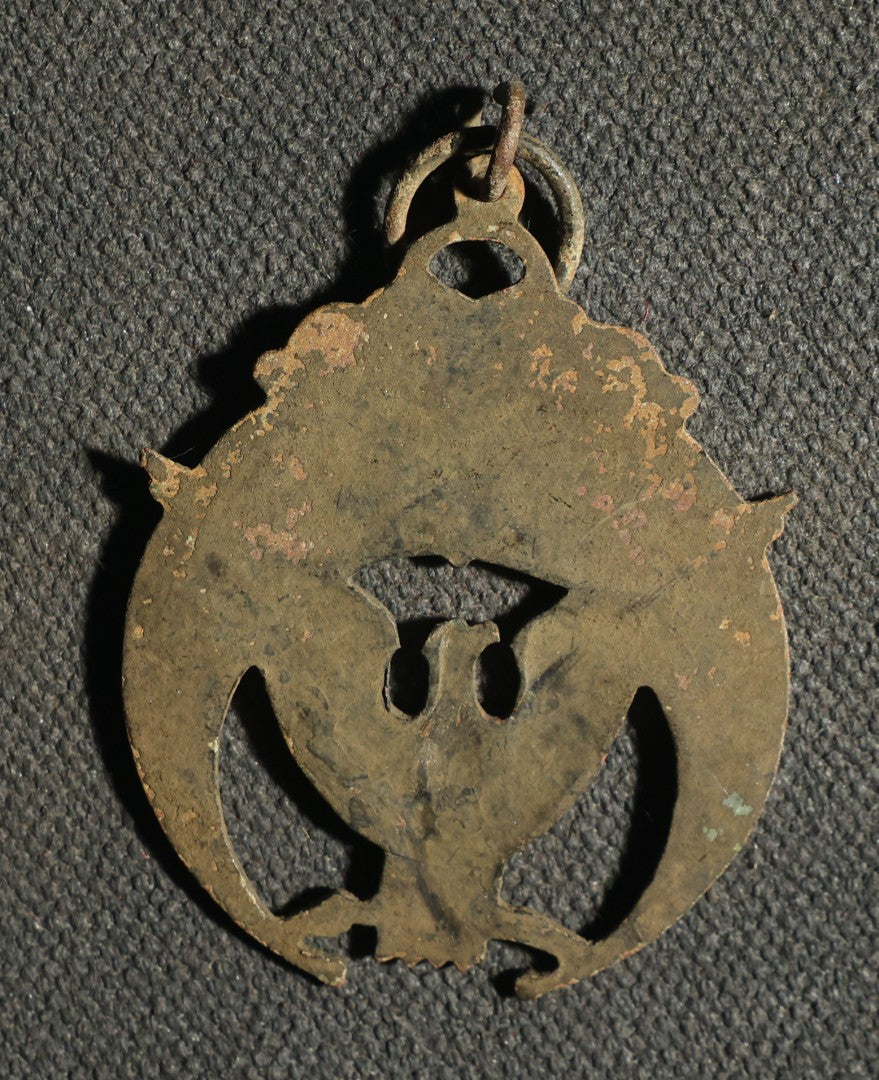 Four Pieces Including Federal Order of Eagles and Track Fobs, and Pair of Syracuse New York Centennial Coins