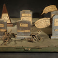 Lot 001 - Antique Folk Art Handmade Graveyard Diorama with Wooden Gravestones, Twisted Pipe Cleaner Skeleton Figures, and Hand-Lettered Speech Bubbles, "The Grove Ghosts Inc Knights of Fun", 16-1/4" L x 12-1/2" W