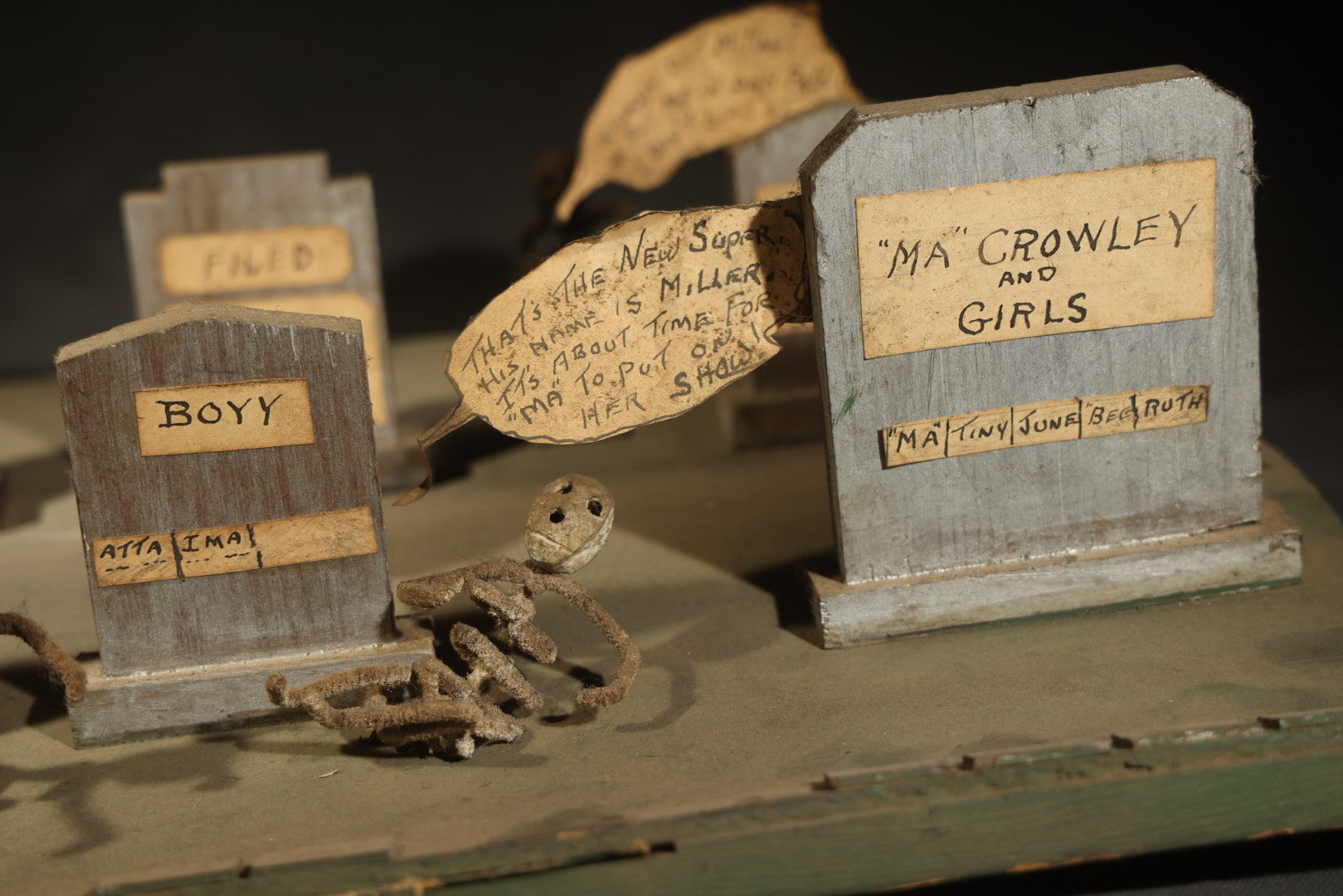 Antique Folk Art Handmade Graveyard Diorama with Wooden Gravestones, Twisted Pipe Cleaner Skeleton Figures, and Hand-Lettered Speech Bubbles, "The Grove Ghosts Inc Knights of Fun"