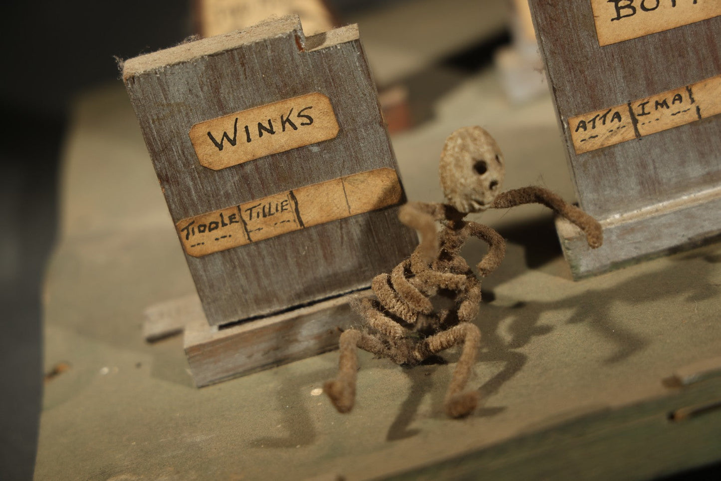 Antique Folk Art Handmade Graveyard Diorama with Wooden Gravestones, Twisted Pipe Cleaner Skeleton Figures, and Hand-Lettered Speech Bubbles, "The Grove Ghosts Inc Knights of Fun"