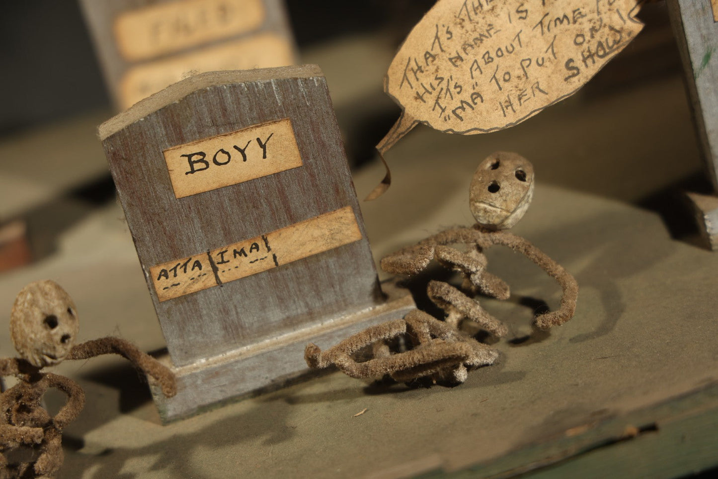 Antique Folk Art Handmade Graveyard Diorama with Wooden Gravestones, Twisted Pipe Cleaner Skeleton Figures, and Hand-Lettered Speech Bubbles, "The Grove Ghosts Inc Knights of Fun"