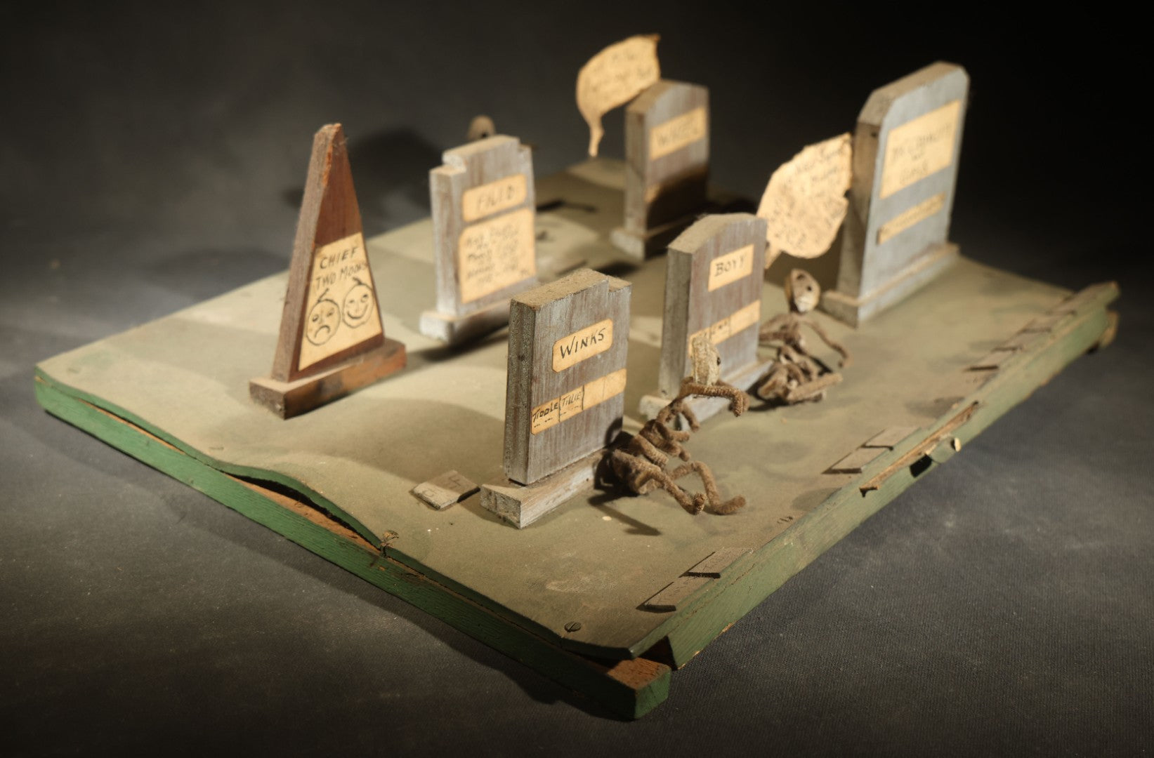 Antique Folk Art Handmade Graveyard Diorama with Wooden Gravestones, Twisted Pipe Cleaner Skeleton Figures, and Hand-Lettered Speech Bubbles, "The Grove Ghosts Inc Knights of Fun"
