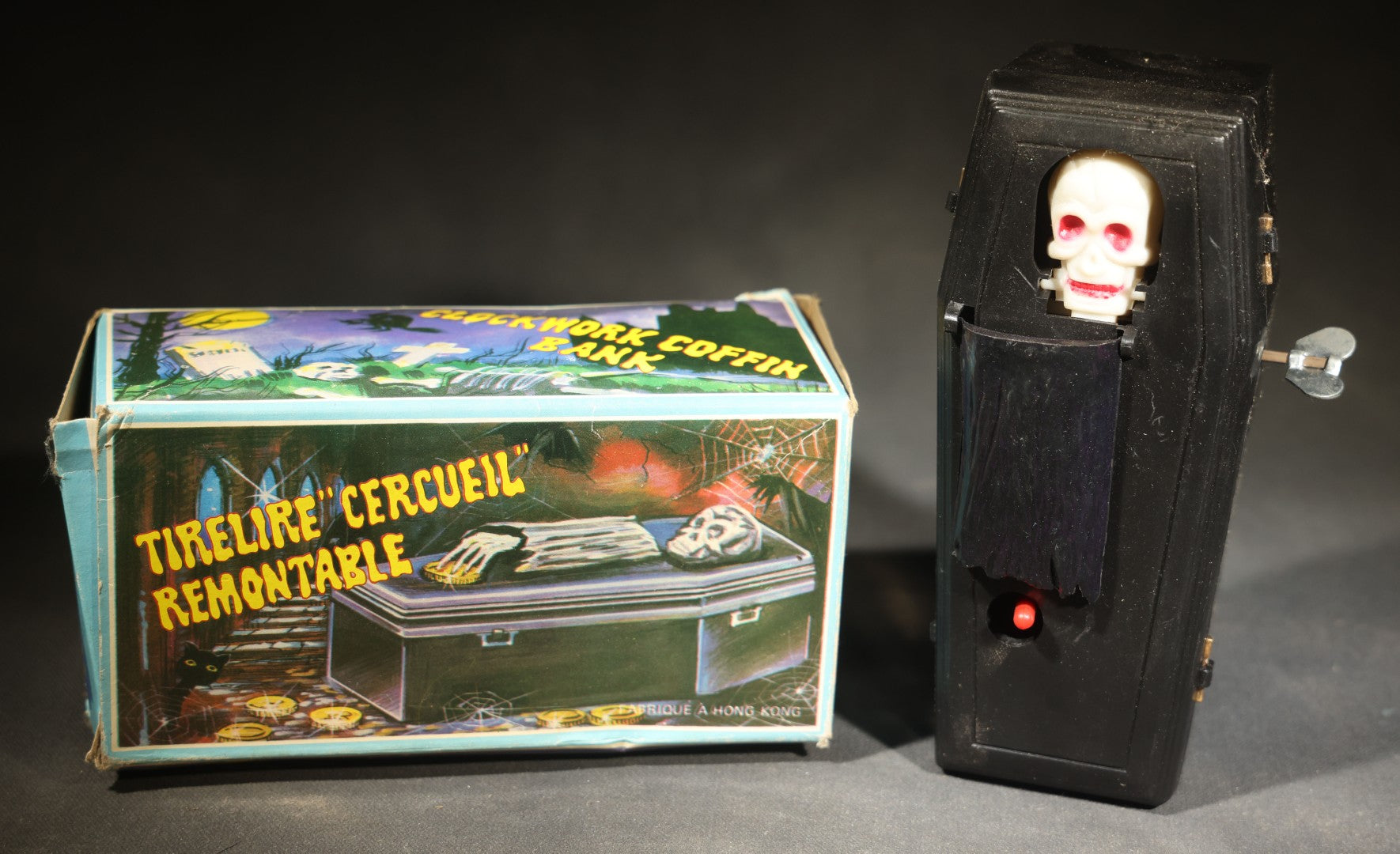 Vintage "Clockwork Coffin Bank" Wind-Up Skeleton Mechanical Bank, "They Buried Me in Las Vegas" Souvenir, Made in Hong Kong, with Original Box