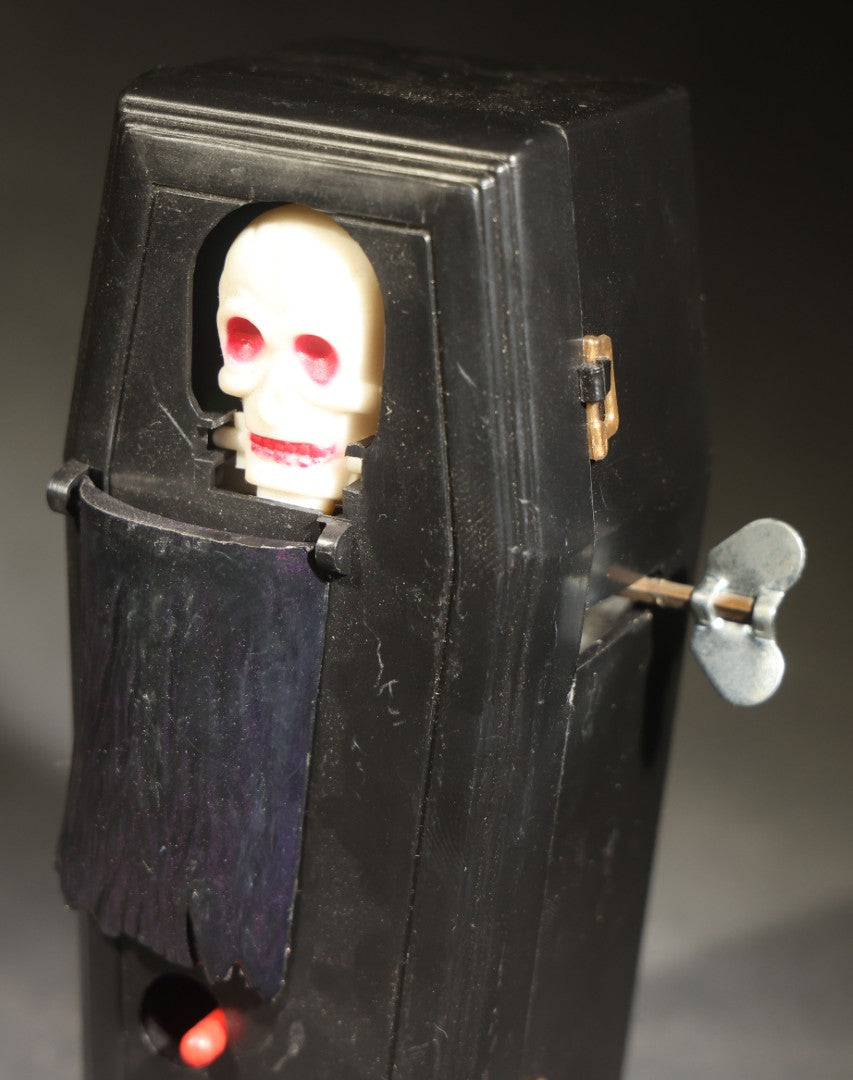 Vintage "Clockwork Coffin Bank" Wind-Up Skeleton Mechanical Bank, "They Buried Me in Las Vegas" Souvenir, Made in Hong Kong, with Original Box