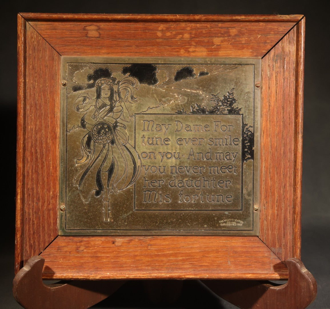 Antique Engraved Brass "Dame Fortune" Plaque in Oak Frame, Manufactured by The Wharff-Eaton Co. Inc., Copyrighted 1902