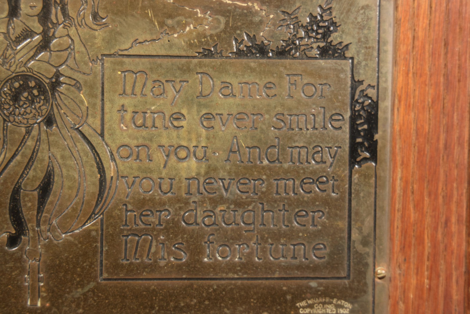 Antique Engraved Brass "Dame Fortune" Plaque in Oak Frame, Manufactured by The Wharff-Eaton Co. Inc., Copyrighted 1902