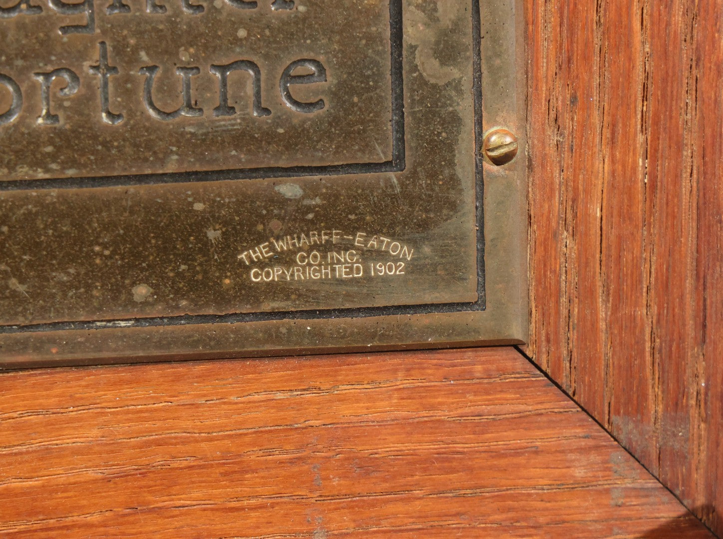Antique Engraved Brass "Dame Fortune" Plaque in Oak Frame, Manufactured by The Wharff-Eaton Co. Inc., Copyrighted 1902
