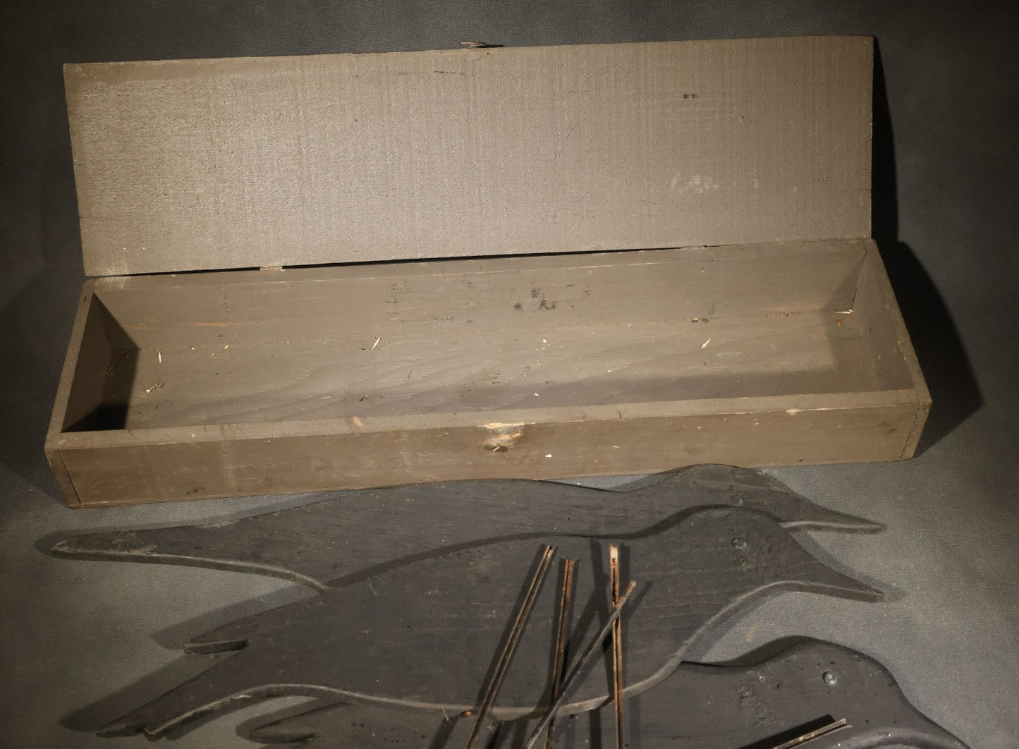 Grouping of Five Antique Black-Painted Flat Crow Silhouette Stick-Up Decoys with Support Poles in Wooden Storage Box