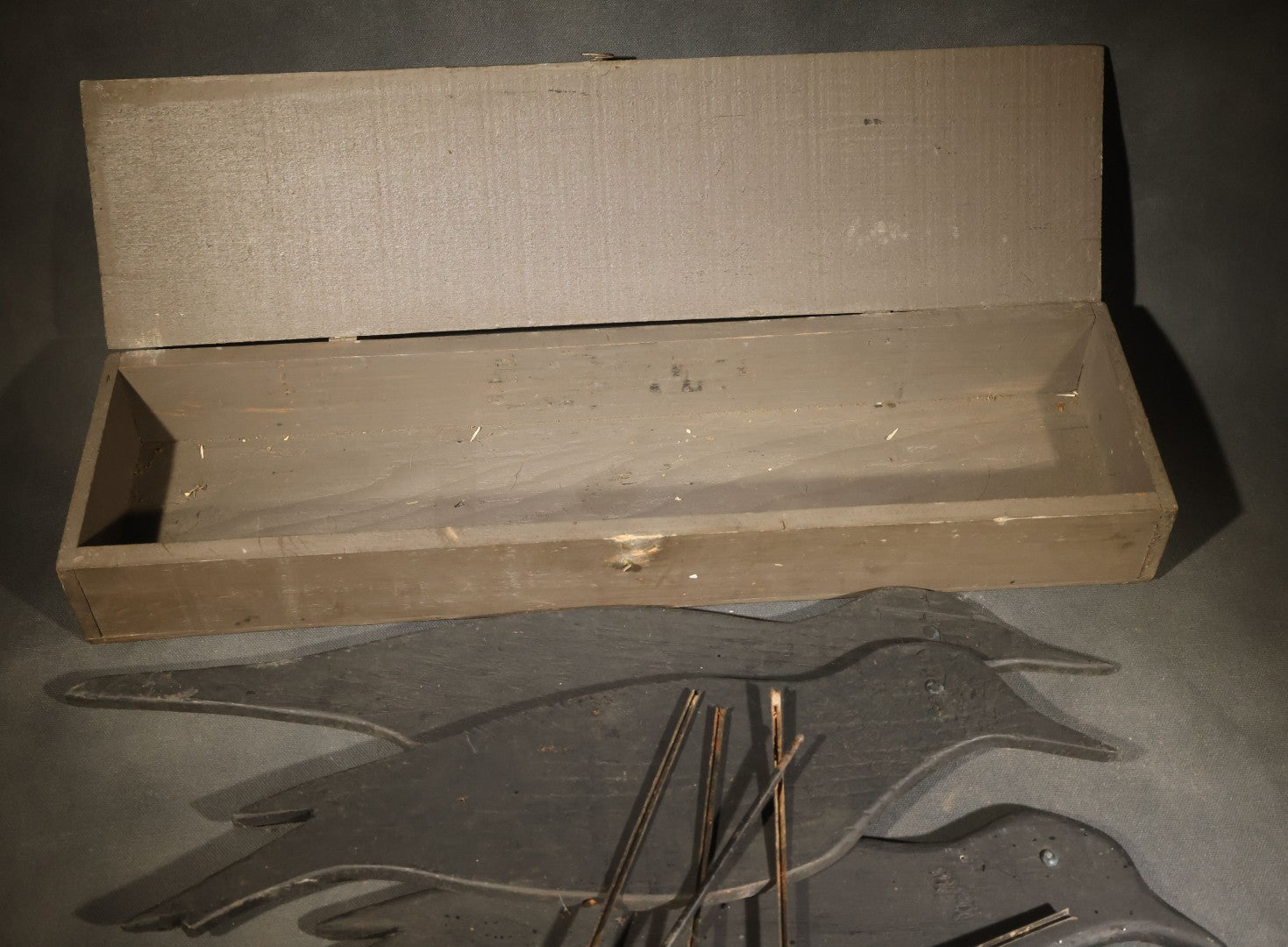 Grouping of Five Antique Black-Painted Flat Crow Silhouette Stick-Up Decoys with Support Poles in Wooden Storage Box